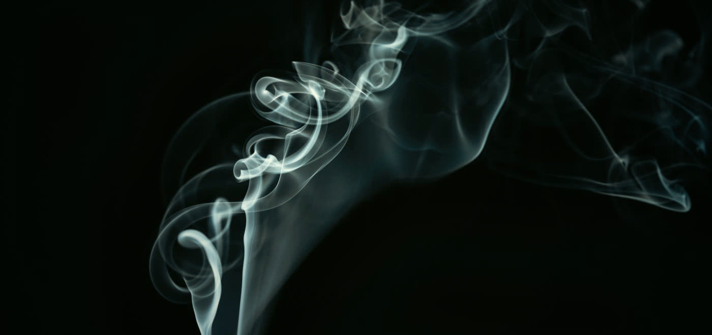 Abstract waves of smoke in the dark